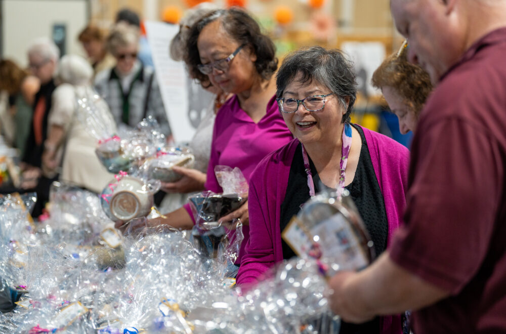 Attendees select bowls at Empty Bowls event