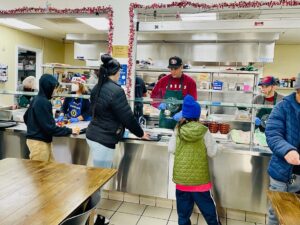 Volunteers at GRIP Souper Center serve a holiday meal.