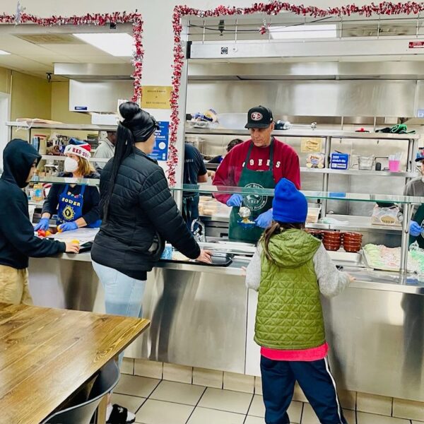 Volunteers at GRIP Souper Center serve a holiday meal.