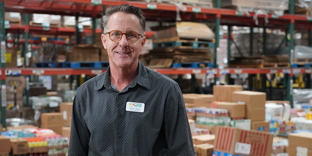 A man in glasses stands in our Concord warehouse.