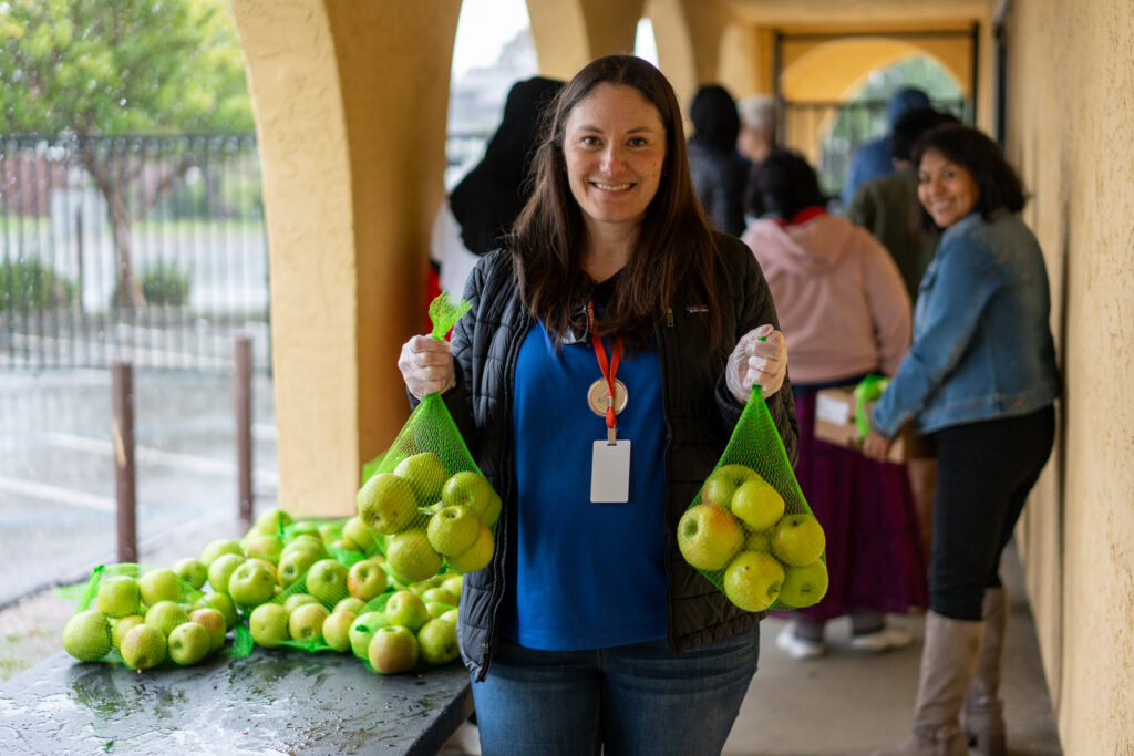 Food Bank CEO Caitlin Sly at a food distribution