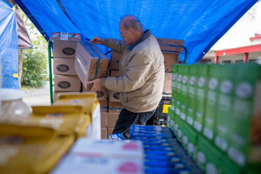 A volunteer at Richmond Emergency Food Pantry prepares for a food distribution.